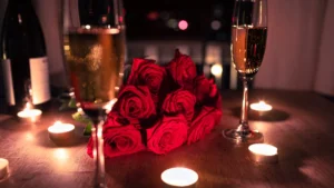 romantic dinner setting complete with champagne and roses