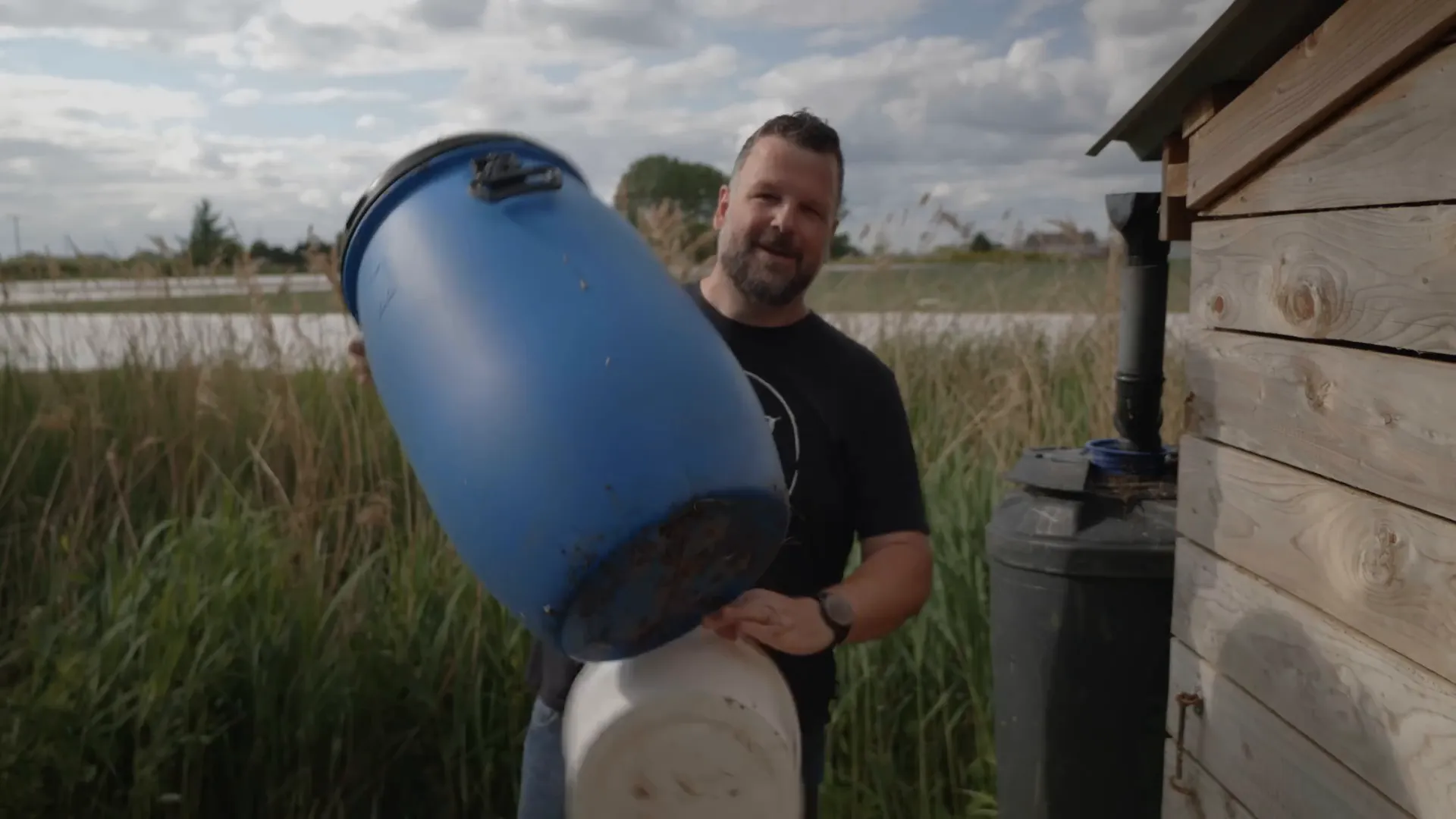 Using a bucket and collecting rainwater